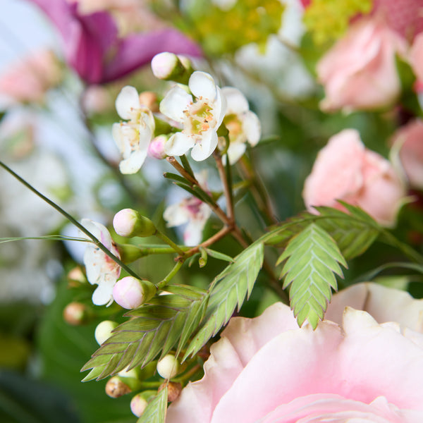 Just Between Friends (Lisianthus / Clematis / Stocks / Roses / Spray Rose / Waxflower / Anthurium / Chasmanthium / Eucalyptus / Bupleurem)