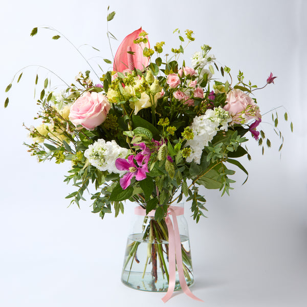 Just Between Friends (Lisianthus / Clematis / Stocks / Roses / Spray Rose / Waxflower / Anthurium / Chasmanthium / Eucalyptus / Bupleurem)